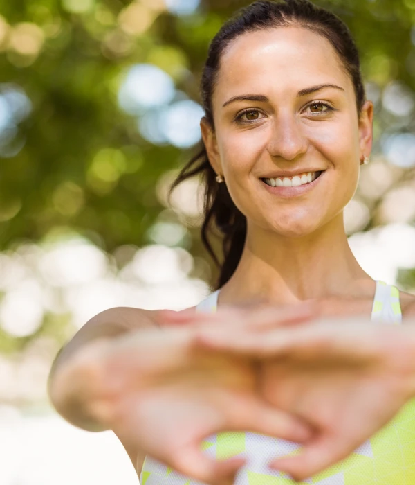 twilight-environment-woman-green-tank-top-smiles-camera-enviroment-page