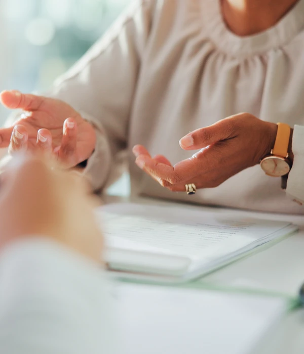 twilight-therapy-woman-sitting-table-hands-clasped