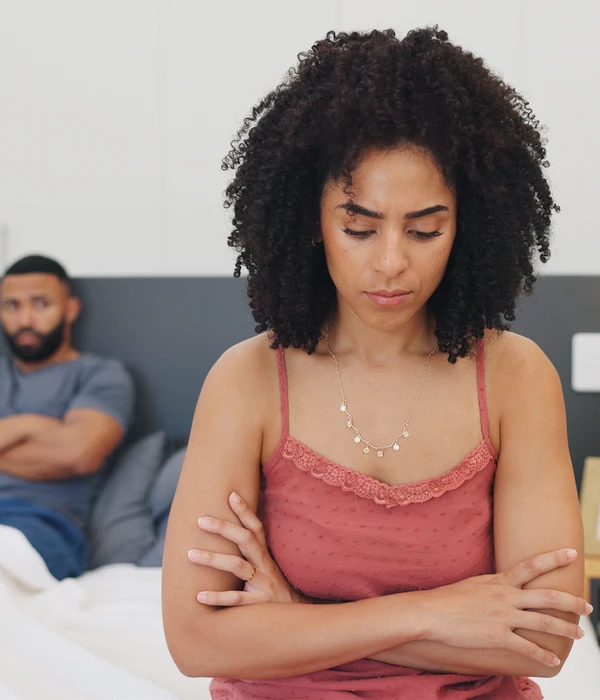 oman-pink-top-sitting-bed-arms-crossed